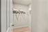 Bright, spacious walk-in closet with modern shelving and ample storage space, perfect for maximizing organization.