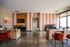 Contemporary office space with stylish wallpaper, modern desks, and vibrant decor for a welcoming atmosphere.