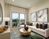 Chic and modern living room with elegant decor, vibrant throw pillows, and a stunning city skyline view through large glass doors.
