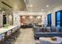 Luxurious open-concept living space with elegant lighting, modern seating, and panoramic city views.