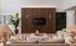 Elegant modern living room with comfortable beige sofas, textured lamps, and vibrant green wall decor