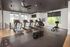 Bright and modern fitness center with state-of-the-art treadmills, exercise bike, and ample equipment, set against large windows with lush green views.