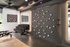 Modern gym space featuring a unique Freedom Climber wall and a well-equipped dumbbell rack, perfect for fitness enthusiasts.