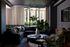 Sophisticated living room with a modern gray sectional sofa, lush potted plant, and stylish chandelier, inviting natural light through large windows.