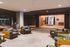 Inviting apartment lobby with cozy seating, stylish decor, and ambient lighting creating a warm welcome.