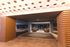 Modern and inviting apartment lobby featuring stylish ceiling lighting, sleek wooden accents, and comfortable seating areas.