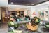 Luxurious and modern living area with stylish furniture, chic lighting, and vibrant decor, creating an inviting and sophisticated ambiance.