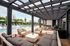 Luxurious outdoor lounge with stylish pergola and inviting poolside seating, perfect for relaxation and entertaining.