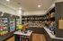Modern apartment convenience store featuring well-stocked shelves with snacks, beverages, and groceries in a sleek, stylish setting.