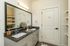 Elegant bathroom featuring a double sink vanity with sleek granite countertops and modern decor accents.