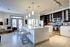 Modern and inviting kitchen with sleek appliances, elegant lighting, spacious island counter, and a bright, open design perfect for entertaining.