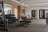 Elegant apartment gym featuring modern equipment, sleek design, and ample space for workouts.