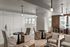 Chic open-plan lounge with modern seating, stylish lighting, and large windows in a bright, airy apartment.
