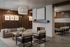 Elegant apartment lobby featuring cozy seating, modern fireplace, and stylish pendant lighting for a welcoming atmosphere.