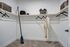 Spacious walk-in closet with plush carpet, organized shelving, and ample hanging space for stylish storage solutions.