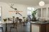 Chic cafe area with modern decor, vibrant wall art with 'Dare to be Bold' slogan, and cozy seating perfect for relaxation.