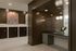 Elegant apartment lobby with contemporary art, a spacious counter with modern lighting, and individual mailboxes.
