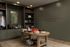 Elegant home office with organized storage, sophisticated decor, and motivational wall art.