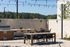 Inviting outdoor patio with elegant seating, strung lights, and lush greenery, perfect for entertaining and relaxation.