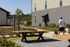 Attractive garden vista of modern building exterior with lush landscaping and inviting pathways, ideal for leisurely strolls.