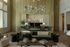 Elegant living room with modern open kitchen featuring a cozy seating area, stylish decor, and warm lighting.