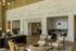 Charming living area with elegant seating, cozy dining nook, and inspirational wall art, perfect for stylish modern living.