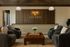 Elegant and inviting lobby area at Livano, featuring modern plush seating and a stylish wooden reception desk.