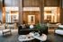 Sophisticated lounge area featuring elegant wooden paneling, plush seating, and modern decor at Livano.