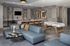 Contemporary open-concept living area with plush seating, modern art, and sleek pendant lighting, perfect for entertaining.