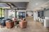 Sophisticated modern living area featuring plush furniture, elegant lighting fixtures, and a spacious open layout perfect for entertaining.