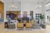 Elegant modern living room with chic d&eacute;cor, featuring stylish furnishings, a cozy fireplace, and ample natural light.