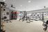 Modern fitness center with state-of-the-art equipment, featuring treadmills, weight machines, and an inviting workout atmosphere with ample natural light.