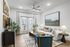 Bright and inviting living room with modern decor, featuring a comfortable white sofa, elegant wooden coffee table, and stylish art pieces, all under natural sunlight streaming through large glass doors.