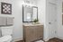 Modern bathroom with a sleek vanity, large mirror, and elegant lighting, designed for comfort and style.