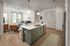 Modern apartment interior featuring a stylish open-plan kitchen with a sleek island, cozy living area with natural light, and elegant lighting fixtures.