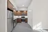 Modern kitchen with stainless steel appliances, elegant wooden cabinetry, and ambient lighting for a sleek culinary space.
