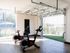 Bright and airy home gym featuring sleek exercise bikes and a scenic view, perfect for a revitalizing workout.