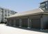 Modern apartment complex with sleek garage units and stylish balconies, offering convenient and elegant urban living.