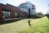 Charming apartment complex featuring modern architecture, spacious outdoor area, and pet-friendly amenities.