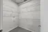 Spacious walk-in closet with organized wire shelving and modern design, perfect for ample storage.