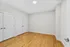 Elegant room with polished hardwood floors, fresh neutral walls, and sleek double-door closets, providing ample storage space in a modern apartment.