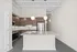 Elegant kitchen with modern appliances, granite countertops, and stylish pendant lighting.