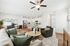 Bright, open-concept living area with stylish decor, modern kitchen, and cozy seating, perfect for comfortable living and entertaining.