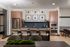 Modern kitchen design with sleek countertops, elegant pendant lighting, and cozy seating; a perfect blend of style and functionality.