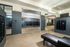 Sleek apartment lobby with modern mailroom and inviting lounge area, perfect for comfortable living.