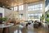 Bright and inviting apartment lobby with modern stone accent wall, stylish seating, and abundant natural light from large windows.