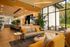 Bright modern living area with stylish furnishings, expansive windows, and sleek open-concept design, perfect for relaxation and entertainment.