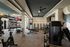 Modern fitness center with state-of-the-art gym equipment, bright lighting, and motivational decor.
