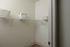 Spacious walk-in closet with ample shelving and elegant storage baskets, offering organized luxury and convenience.