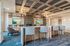 Luxurious modern lounge with sophisticated decor, featuring elegant seating, ambient lighting, and a stylish media wall with a scenic display.
